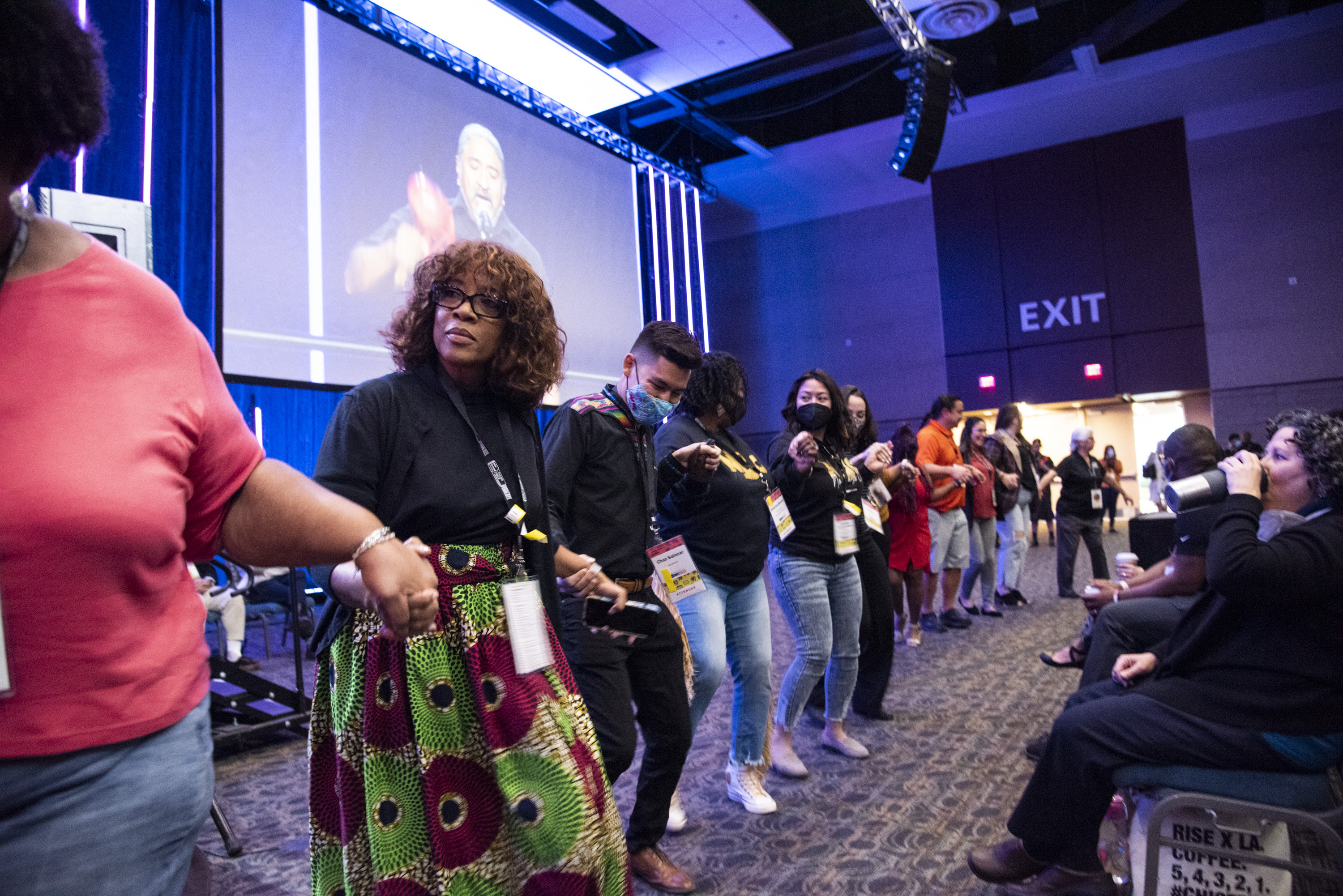 Photo of conference attendees celebrating a performance