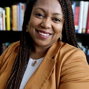 Professional headshot of a Black woman smiling