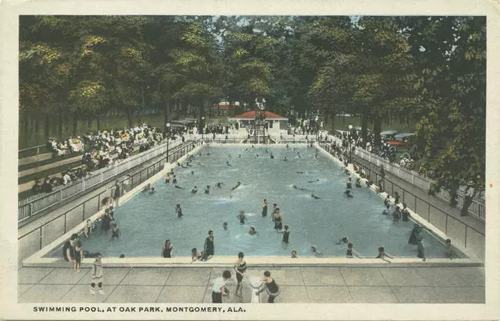 Large pool in use by many people. Caption: Swimming pool, at Oak Park, Montgomery, Ala.