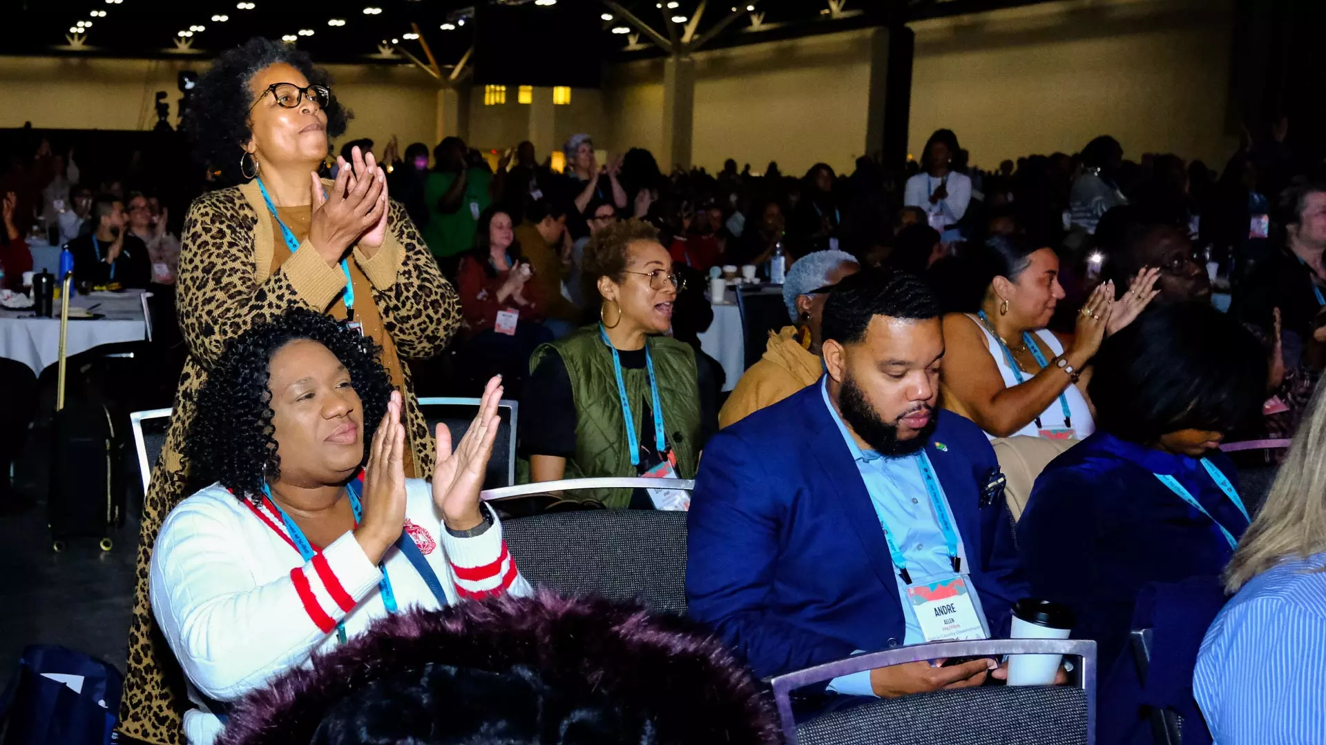 People standing up clapping